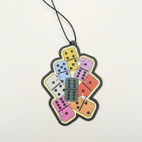 Colorful domino-shaped keychain on a blue background
